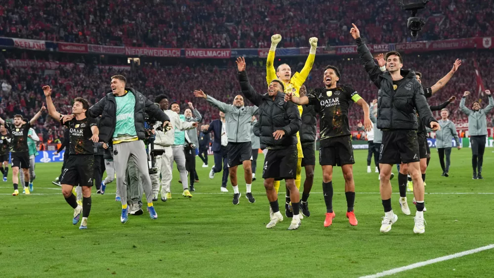 PSG players celebrate after the Champions League semifinal second leg soccer match between Bayern Munich and Paris Saint Germain in Munich, Germany, Wednesday, May 6, 2026. (AP Photo/Martin Meissner)