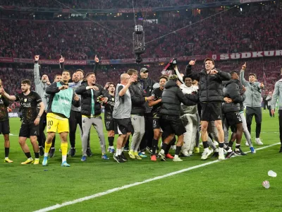 PSG players celebrate after the Champions League semifinal second leg soccer match between Bayern Munich and Paris Saint Germain in Munich, Germany, Wednesday, May 6, 2026. (AP Photo/Martin Meissner)