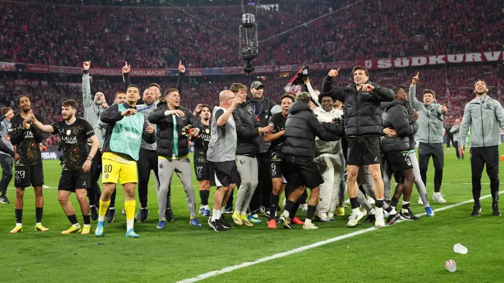 PSG players celebrate after the Champions League semifinal second leg soccer match between Bayern Munich and Paris Saint Germain in Munich, Germany, Wednesday, May 6, 2026. (AP Photo/Martin Meissner)