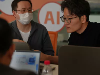 People install RedClaw AI software on their laptops in Beijing on March 22, 2026. (AP Photo/Andy Wong)