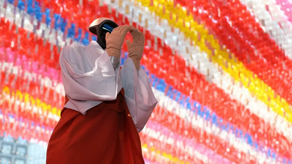 Humanoid robot Gabi folds its hands during a precept ceremony at a temple in Seoul, South Korea, May 6, 2026.  Yonhap via REUTERS  THIS IMAGE HAS BEEN SUPPLIED BY A THIRD PARTY. NO RESALES. NO ARCHIVES. SOUTH KOREA OUT. NO COMMERCIAL OR EDITORIAL SALES IN SOUTH KOREA.