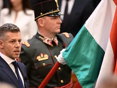 Peter Magyar takes the oath as Hungary's prime minister during a ceremony in Budapest, Hungary, Saturday, May 9, 2026. (AP Photo/Denes Erdos)