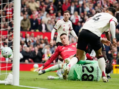 Manchester United's Benjamin Sesko, centre, scores his side's second goal during the English Premier League soccer match between Manchester United and Liverpool in Manchester, England, Sunday, May 3, 2026. (AP Photo/Dave Thompson)