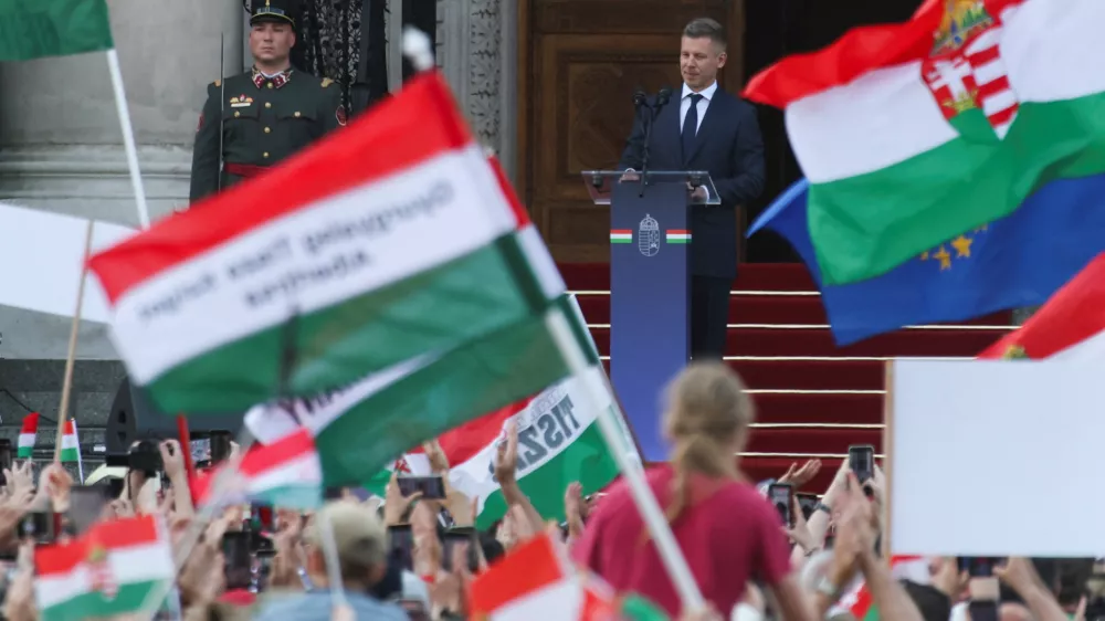 People look on as Hungarian Prime Minister Peter Magyar delivers his speech in front of the Hungarian Parliament, after taking his oath of office, in Budapest, Hungary, May 9, 2026. REUTERS/Leonhard Foeger