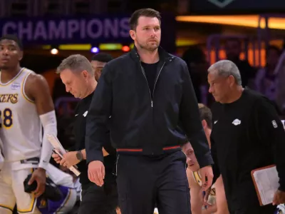 May 9, 2026; Los Angeles, California, USA; Los Angeles Lakers guard Luka Doncic (77) looks on from the bench in the final minutes of game three of the second round of the 2026 NBA Playoffs against the Oklahoma City Thunder at Crypto.com Arena. Mandatory Credit: Jayne Kamin-Oncea-Imagn Images