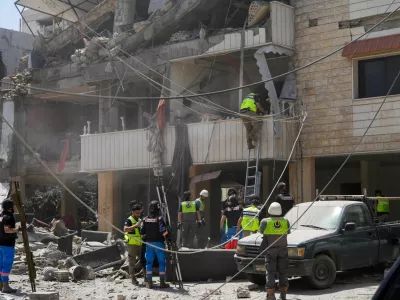 Rescuers work at the site of an Israeli strike in Kfar Jouz, Lebanon, May 11, 2026. REUTERS/Stringer