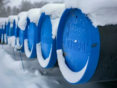 2BREMR0 Barnaul, Russia-13.12.2018: pipes for gasification with the inscription Gazprom lie in an open warehouse in winter.