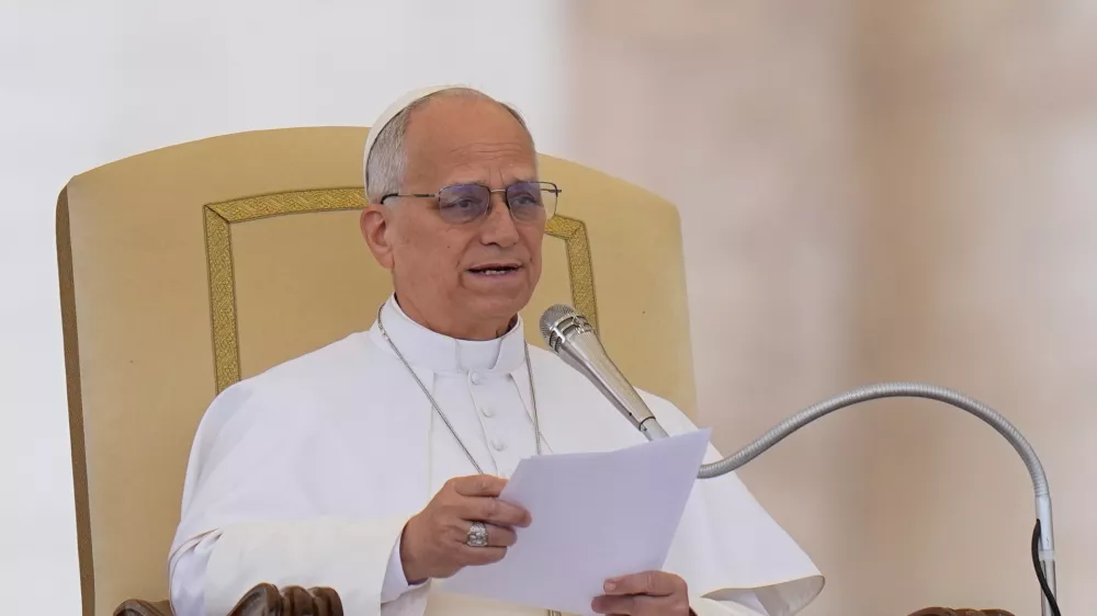 Pope Leo XIV delivers his speech during his weekly general audience in St. Peter's Square, at the Vatican, Wednesday, May 13, 2026. (AP Photo/Alessandra Tarantino)