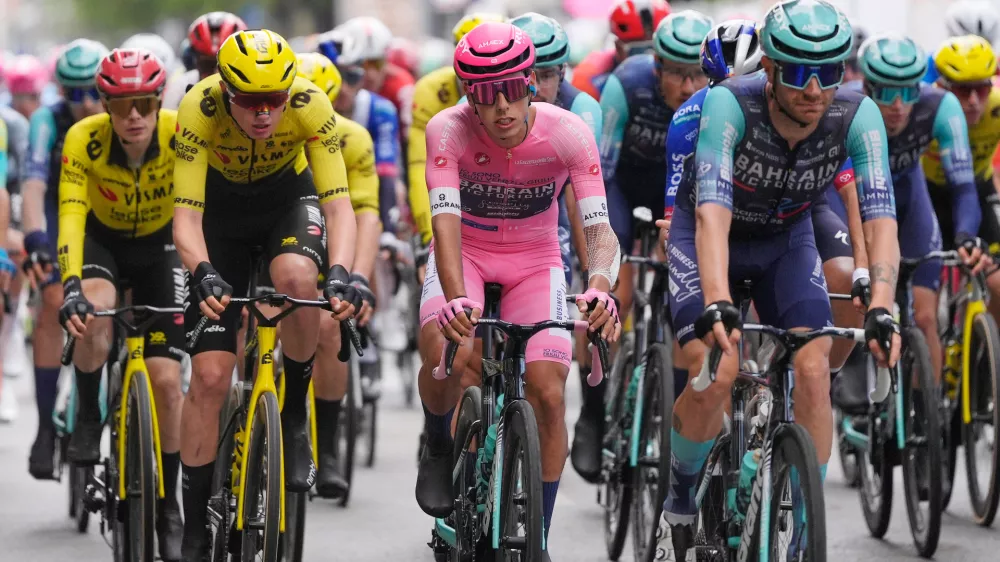 Portugal's Afonso Oliveira Eulalio wears the pink jersey of the race overall leader as he pedals in the pack, during the 6th stage of the Giro d'Italia cycling race, from Paestum to Naples, Italy, Thursday, May 14, 2026. (Fabio Ferrari/LaPresse via AP)