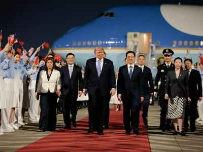 U.S. President Donald Trump walks with Chinese Vice President Han Zheng during an arrival ceremony at Beijing Capital International Airport, in Beijing, China, May 13, 2026. REUTERS/Evan Vucci