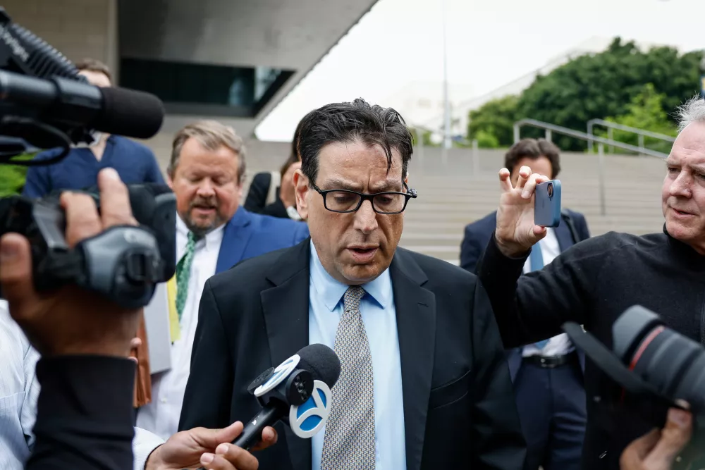 Erik Fleming departs federal court in Los Angeles after being sentenced in connection with the ketamine overdose death of actor Matthew Perry, on Wednesday, May 13, 2026, in Los Angeles. (AP Photo/Caroline Brehman)