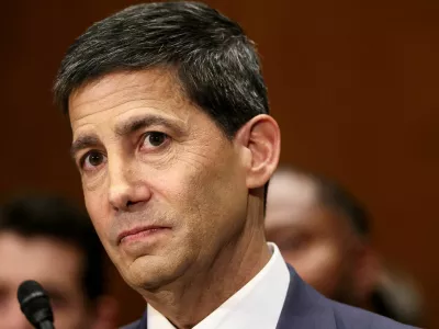 FILE PHOTO: Kevin Warsh, U.S. President Donald Trump's nominee to be next chair of the Federal Reserve, testifies before a Senate Banking Committee confirmation hearing on Capitol Hill in Washington, D.C., U.S., April 21, 2026. REUTERS/Kevin Lamarque/File Photo