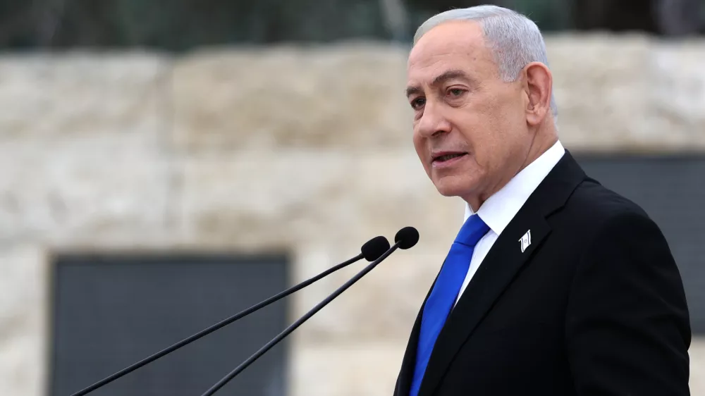 FILE - Israel's Prime Minister Benjamin Netanyahu attends a ceremony at the Military Cemetery on Mount Herzl in Jerusalem, April 21, 2026. (Ilia Yefimovich/Pool Photo via AP, File)