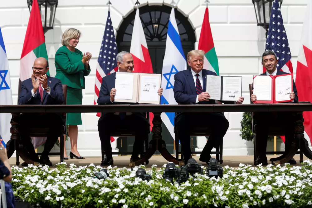 Bahrain&acirc;&euro;&trade;s Foreign Minister Abdullatif Al Zayani, Israel's Prime Minister Benjamin Netanyahu, U.S. President Donald Trump and United Arab Emirates (UAE) Foreign Minister Abdullah bin Zayed participate in the signing of the Abraham Accords, normalizing relations between Israel and some of its Middle East neighbors in a strategic realignment of Middle Eastern countries against Iran, on the South Lawn of the White House in Washington, U.S., September 15, 2020. REUTERS/Tom Brenner