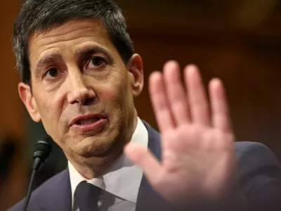 FILE PHOTO: Kevin Warsh, U.S. President Donald Trump's nominee to be next chair of the Federal Reserve, testifies before a Senate Banking Committee confirmation hearing on Capitol Hill in Washington, D.C., U.S., April 21, 2026. REUTERS/Kevin Lamarque/File Photo