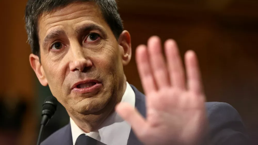 FILE PHOTO: Kevin Warsh, U.S. President Donald Trump's nominee to be next chair of the Federal Reserve, testifies before a Senate Banking Committee confirmation hearing on Capitol Hill in Washington, D.C., U.S., April 21, 2026. REUTERS/Kevin Lamarque/File Photo