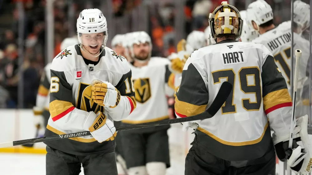 Vegas Golden Knights right wing Pavel Dorofeyev, left, celebrates his goal with goaltender Carter Hart during the third period in Game 6 of a second-round NHL hockey Stanley Cup playoff series against the Anaheim Ducks, Thursday, May 14, 2026, in Anaheim, Calif. (AP Photo/Mark J. Terrill)