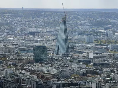 This photograph taken from the observation gallery on the top of the Tour Montparnasse (Montparnasse Tower) shows the Tour Triangle, designed by Swiss firm Herzog & de Meuron, under construction in Paris on March 30, 2026,Image: 1087703324, License: Rights-managed, Restrictions:, Model Release: no 