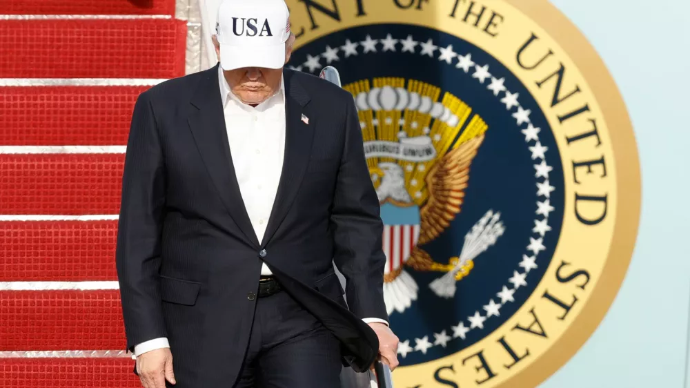 President Donald Trump walks down the stairs of Air Force One upon his arrival at Joint Base Andrews, Md., Friday, May 15, 2026. (AP Photo/Luis M. Alvarez)