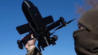 FILE - An instructor from the Ukrainian company General Cherry demonstrates the operation of an anti-air interceptor drone designed to destroy Russian attack drones in Kyiv region, on March 11, 2026. (AP Photo/Efrem Lukatsky, File)