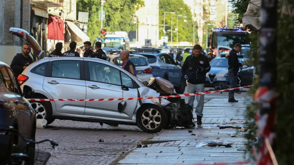 Police work at the scene after several people were injured when a car drove into pedestrians in the center of the northern Italian city of Modena, Italy, May 16, 2026. REUTERS/Stringer   TPX IMAGES OF THE DAY