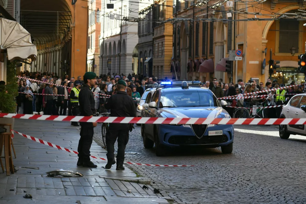 Financial Police patrol a scene after a car incident in a street of Modena, Italy, Saturday, May 16, 2026. (Lapresse via AP)