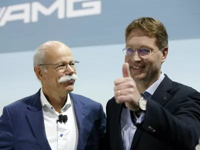 Ola Kallenius, right, member of the Board of Management of Daimler AG. Group Research & Mercedes-Benz Cars Development, gives a thumbs-up as Dieter Zetsche, Chairman of the Board of Management of Daimler AG, Head of Mercedes-Benz Cars, looks on during a media preview at the Auto show in Paris, France, Tuesday, Oct. 2, 2018, 2018. (AP Photo/Thibault Camus)