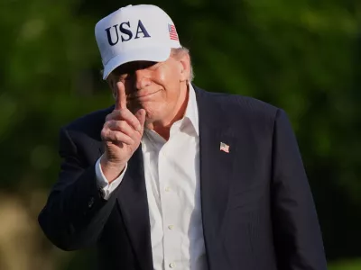 President Donald Trump walks across the South Lawn of the White House, Friday, May 15, 2026, in Washington, on return from Beijing where he met with China's President Xi Jinping. (AP Photo/Jacquelyn Martin)