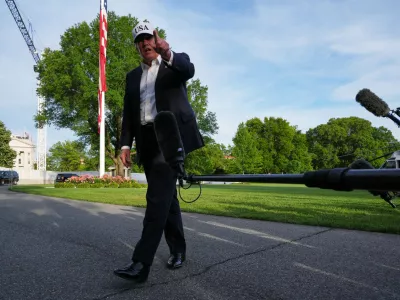 President Donald Trump speaks to reporters on the South Lawn of the White House, Friday, May 15, 2026, in Washington, on return from Beijing where he met with China's President Xi Jinping. (AP Photo/Jacquelyn Martin)