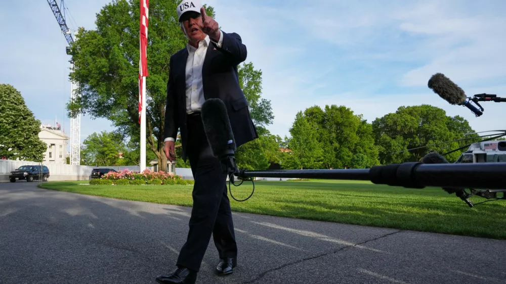 President Donald Trump speaks to reporters on the South Lawn of the White House, Friday, May 15, 2026, in Washington, on return from Beijing where he met with China's President Xi Jinping. (AP Photo/Jacquelyn Martin)