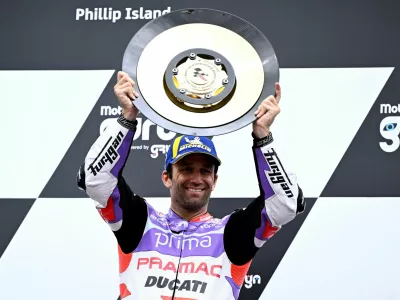MotoGP - Australian Grand Prix - Phillip Island Grand Prix Circuit, Victoria, Australia - October 21, 2023 Prima Pramac Racing's Johann Zarco celebrates with the trophy on the podium after winning the race Joel Carrett/AAP Image via REUTERS   ATTENTION EDITORS - THIS IMAGE WAS PROVIDED BY A THIRD PARTY. NO RESALES. NO ARCHIVES. AUSTRALIA OUT. NEW ZEALAND OUT