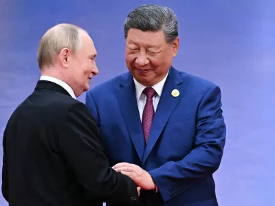FILE - Russian President Vladimir Putin, left, and Chinese President Xi Jinping greet each other in Tianjin, China, on Aug. 31, 2025. (Sergei Bobylev, Sputnik, Kremlin Pool Photo via AP, File)