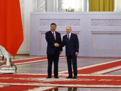 Russian President Vladimir Putin shakes hands with his Chinese counterpart Xi Jinping during a welcoming ceremony before their talks at the Kremlin in Moscow, Russia, May 8, 2025. REUTERS/Evgenia Novozhenina/Pool