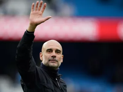 FILE - Manchester City's head coach Pep Guardiola greets fans at the end of the English Premier League soccer match between Manchester City and Brentford in Manchester, Saturday, May 9, 2026. (AP Photo/Dave Thompson, File)