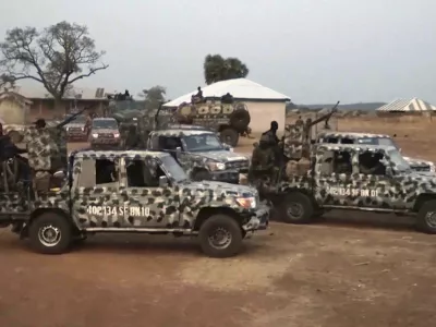 In this screen grab taken from video, Nigerian Army vehicles are parked at the village were children were kidnapped in Kuriga, Kaduna State, Thursday, March. 7, 2024. Gunmen attacked a school in Nigeria's northwest region Thursday morning and abducted at least 287 students, the headteacher told authorities, marking the second mass abduction in the West African nation in less than a week. (AP Video)