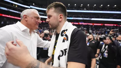Los Angeles Lakers' Luka Doncic, right, hugs his father Sasa Doncic, left, following the team's NBA basketball game against the Dallas Mavericks in Dallas, Wednesday, April 9, 2025. (AP Photo/LM Otero)