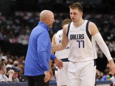 Dallas Mavericks coach Jason Kidd, left, talks with guard Luka Doncic (77), who walks off the court during the first half of the team's preseason NBA basketball game against the Utah Jazz in Dallas, Wednesday, Oct. 6, 2021. (AP Photo/Michael Ainsworth)