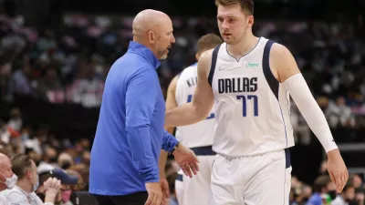 Dallas Mavericks coach Jason Kidd, left, talks with guard Luka Doncic (77), who walks off the court during the first half of the team's preseason NBA basketball game against the Utah Jazz in Dallas, Wednesday, Oct. 6, 2021. (AP Photo/Michael Ainsworth)