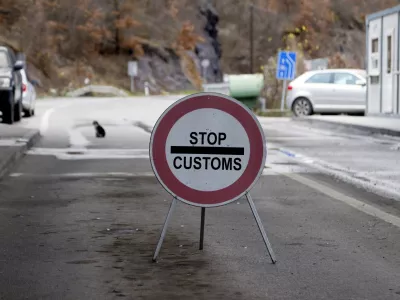 A traffic sign is seen at the closed border crossing of Jarinje, along the Kosovo-Serbia border, Kosovo, Sunday, Dec. 11, 2022. Kosovo police and the local media on Sunday reported explosions, shooting and road blocks overnight in the north of the country, where the popoulation is mostly ethnic Serb, despite the postponement of the Dec. 18 municipal election the Serbs were opposed to. No injuries have been reported. (AP Photo/Marjan Vucetic)
