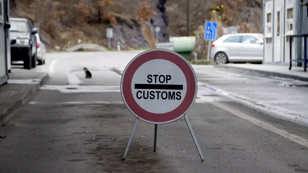 A traffic sign is seen at the closed border crossing of Jarinje, along the Kosovo-Serbia border, Kosovo, Sunday, Dec. 11, 2022. Kosovo police and the local media on Sunday reported explosions, shooting and road blocks overnight in the north of the country, where the popoulation is mostly ethnic Serb, despite the postponement of the Dec. 18 municipal election the Serbs were opposed to. No injuries have been reported. (AP Photo/Marjan Vucetic)