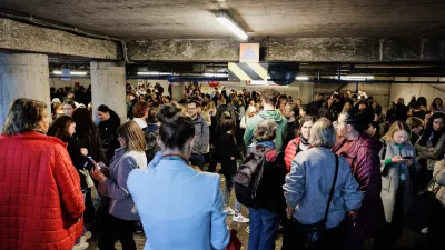 People take shelter in an underground car park during an air raid alert in Vilnius, Lithuania, Wednesday, May 20, 2026. (Vygintas Skaraitis/Lrytas via AP)