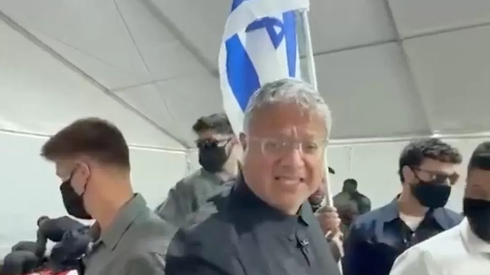 Israeli National Security Minister Itamar Ben Gvir reacts as flotilla activists are detained by Israeli forces, in Ashdod Port, Israel, in this screen grab taken from a video released on May 20, 2026. Office Of Itamar Ben Gvir/Handout via REUTERS  THIS IMAGE HAS BEEN SUPPLIED BY A THIRD PARTY MANDATORY CREDIT VERIFICATION LINES: - Deck structure, bridge, stairs and container of the ship seen in video matched Reuters footage of an Israeli vessel arriving in Ashdod port on May 20 and reportedly carrying activists - Buildings and tent structures matched archive imagery of the Ashdod port and corroborating visuals - Identity of all the detained people could not be independently verified; however Reuters confirmed that some of them were part of the Global Sumud Flotilla by hair and facial features which matched visuals posted on social media by the activists  - Exact date could not verified, but no older version of the video was found posted online before May 20