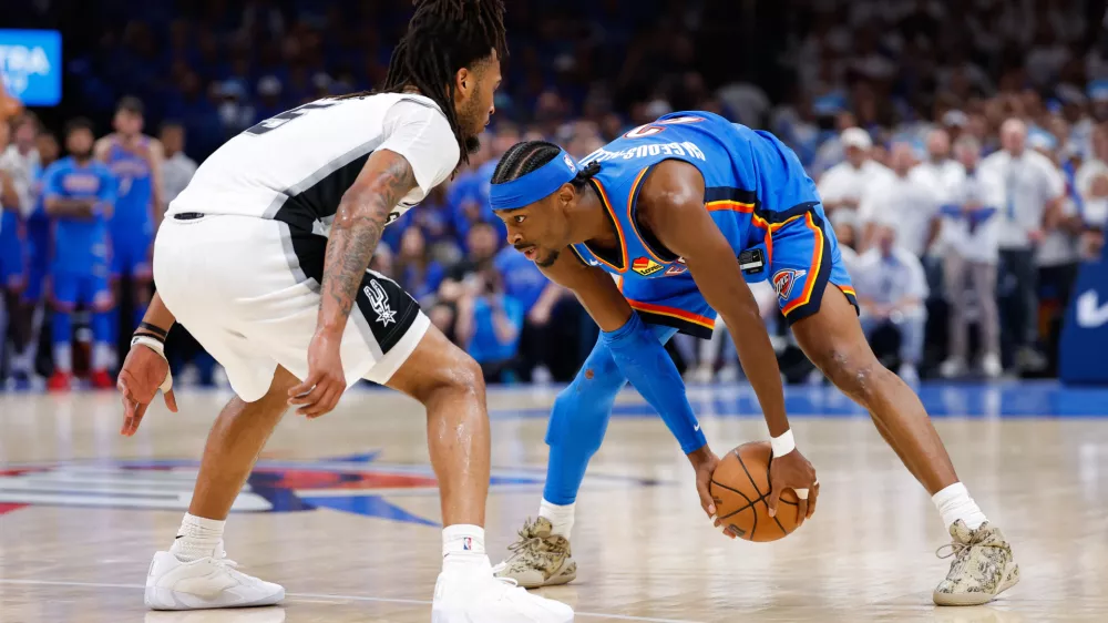 May 20, 2026; Oklahoma City, Oklahoma, USA; Oklahoma City Thunder guard Shai Gilgeous-Alexander (2) looks to pass as San Antonio Spurs guard Stephon Castle (5) defends during the fourth quarter during game two of the western conference finals for the 2026 NBA playoffs at Paycom Center. Mandatory Credit: Alonzo Adams-Imagn Images