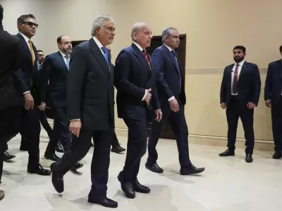 Center from left, Pakistani Deputy Prime Minister and Foreign Minister Mohammad Ishaq Dar, Pakistan's Prime Minister Shehbaz Sharif, and Pakistan's Interior Minister Mohsin Naqvi, arrive for a meeting with U.S. Vice President JD Vance in Islamabad, Pakistan, Saturday, April 11, 2026. (AP Photo/Jacquelyn Martin, Pool)
