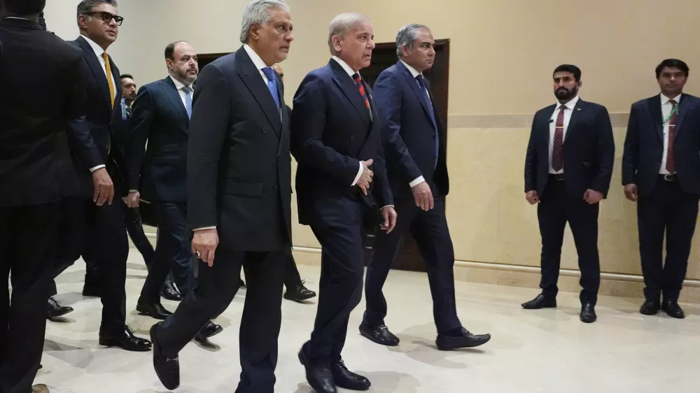 Center from left, Pakistani Deputy Prime Minister and Foreign Minister Mohammad Ishaq Dar, Pakistan's Prime Minister Shehbaz Sharif, and Pakistan's Interior Minister Mohsin Naqvi, arrive for a meeting with U.S. Vice President JD Vance in Islamabad, Pakistan, Saturday, April 11, 2026. (AP Photo/Jacquelyn Martin, Pool)