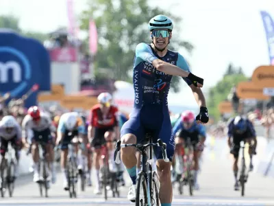 Cycling - Giro d'Italia - Stage 12 - Imperia to Novi Ligure - Italy - May 21, 2026 Bahrain - Victorious' Alec Segaert celebrates winning stage 12 REUTERS/Jennifer Lorenzini