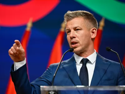 Peter Magyar gestures as he speaks to the media in Budapest, Hungary, Monday, April 13, 2026, after defeating Prime Minister Viktor Orban's party in the country's parliamentary elections. (AP Photo/Denes Erdos)