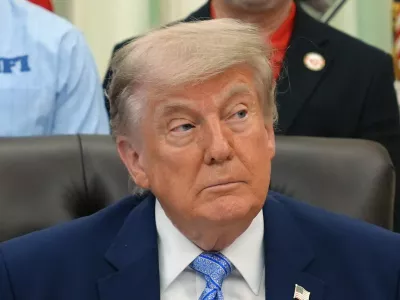 President Donald Trump attends an event about loosening a federal refrigerant rule, in the Oval Office at the White House, Thursday, May 21, 2026, in Washington. (AP Photo/Jacquelyn Martin)