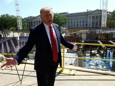 FILE PHOTO: U..S. President Donald Trump gestures at the site of ongoing construction of the planned White House ballroom in Washington, D.C., U.S., May 19, 2026. REUTERS/Kevin Lamarque
