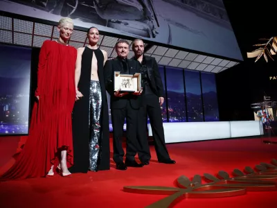 Tilda Swinton and cast members Sebastian Stan and Renate Reinsve pose with director Cristian Mungiu, Palme d'Or award winner for the film "Fjord" during the closing ceremony of the 79th Cannes Film Festival in Cannes, France, May 23, 2026. REUTERS/Marko Djurica